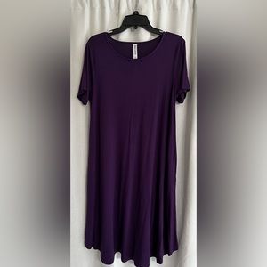Purple T-shirt dress with pockets.